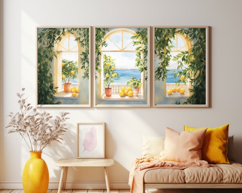 May include: Three watercolor paintings of windows with lemon trees and lemons in pots. The windows are open to a view of the ocean. The paintings are framed in light wood.