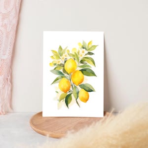 May include: A rectangular art print featuring a watercolor illustration of a cluster of bright yellow lemons hanging from green leafy branches with small white blossoms. The artwork is set against a clean white background, showcasing vibrant citrus fruit.