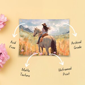 May include: An unframed print showing a watercolour painting of a person riding a horse through a field of wildflowers. The artwork has a matte texture and is acid-free and archival grade.