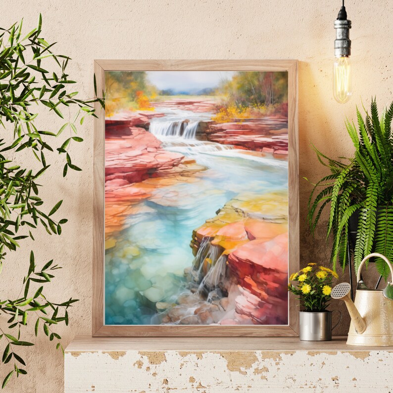 Puede incluir: Una pintura al agua enmarcada que representa una cascada que fluye a trav&eacute;s de un ca&ntilde;&oacute;n rocoso. El agua es de un azul turquesa vibrante y las rocas son una mezcla de rojo, naranja y amarillo. La pintura est&aacute; ambientada en un fondo de exuberantes &aacute;rboles verdes.