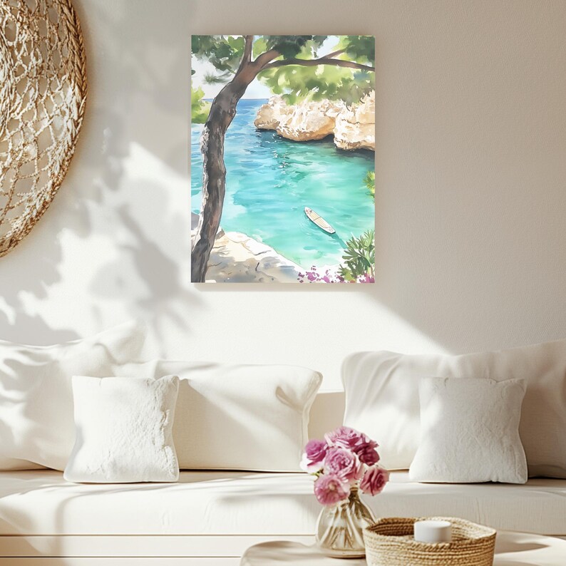 May include: Watercolor painting of a coastal scene with turquoise water, cliffs, and a small boat. A tree frames the view, with green foliage and a glimpse of the blue sky. The artwork is displayed on a white wall.