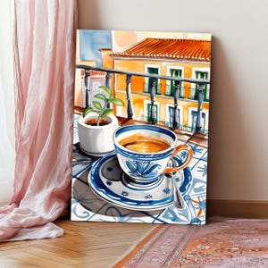 May include: A blue and white patterned coffee cup with a saucer sits on a tiled table with a small potted plant in the background. The cup is filled with coffee and there is a spoon on the saucer. The scene is set on a balcony overlooking a building with orange walls and green windows.
