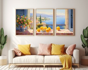 May include: A triptych of framed wall art prints depicting a Mediterranean coastal scene. The left panel shows a vase of pink flowers, the center panel features a bowl of yellow lemons, and the right panel displays a single lemon on a balcony ledge.