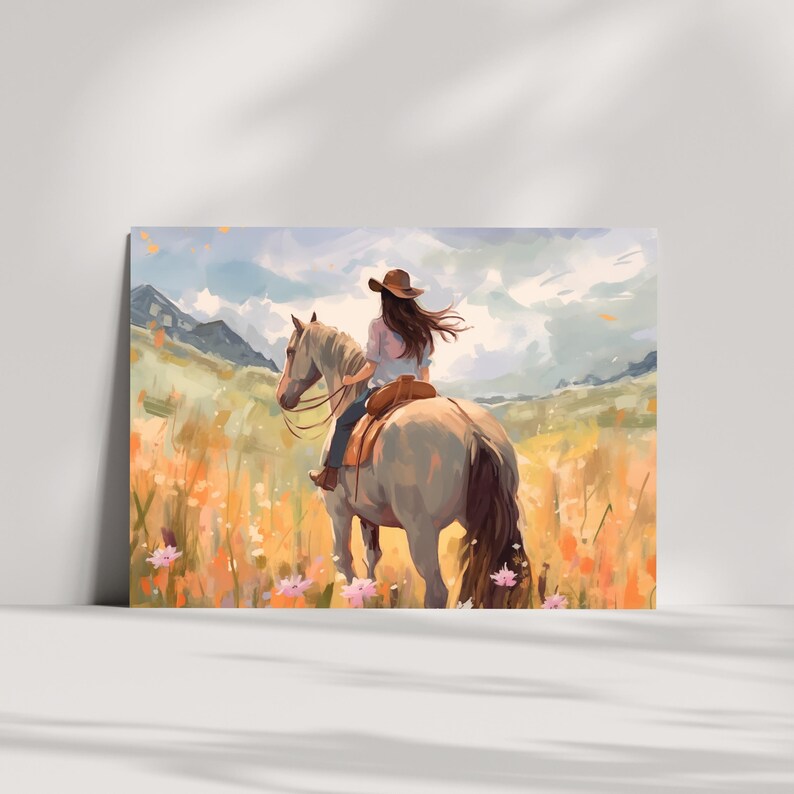 May include: An artistic print showing a person riding a horse through a field of wildflowers. The rider wears a brown hat and a light-coloured shirt. The horse is light grey, and the background features mountains and a cloudy sky. The overall colour palette is warm and inviting.
