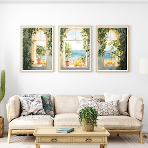 May include: Three framed watercolor paintings of windows with views of the ocean. Each window is framed by lush green vines and features potted lemon trees with ripe yellow lemons.