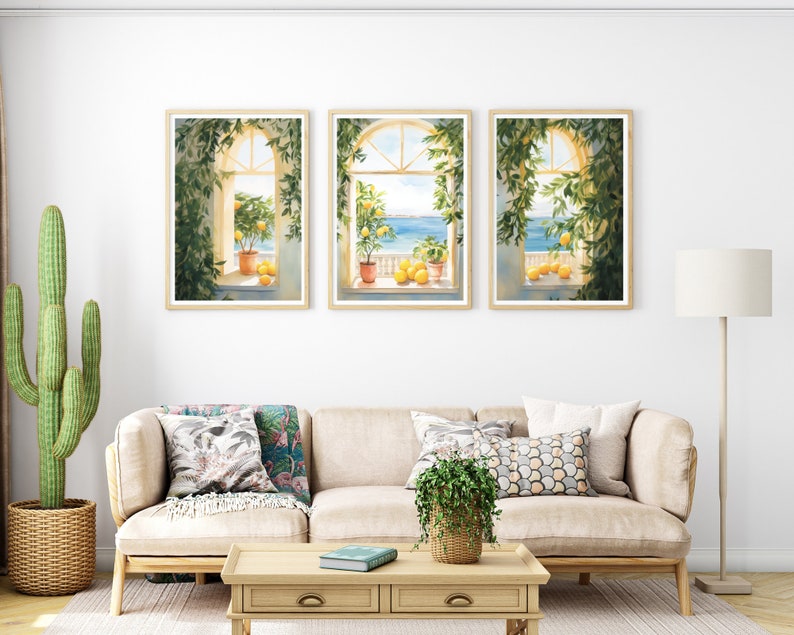 May include: Three framed watercolor paintings of windows with views of the ocean. Each window is framed by lush green vines and features potted lemon trees with ripe yellow lemons.