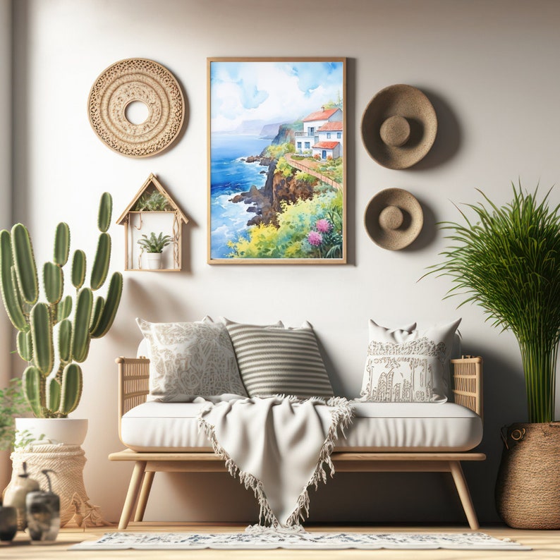 May include: A watercolor painting of a coastal scene with white buildings and red roofs hangs on a white wall. Woven wall decor and a wooden bench with pillows and a blanket complete the room's decor. A cactus and a potted plant are also visible.