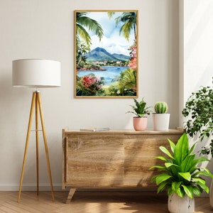 May include: A watercolor painting of a tropical island scene with lush green palm trees, a blue bay, and a mountain in the background. The painting is framed in a light wood frame and is hanging on a white wall.