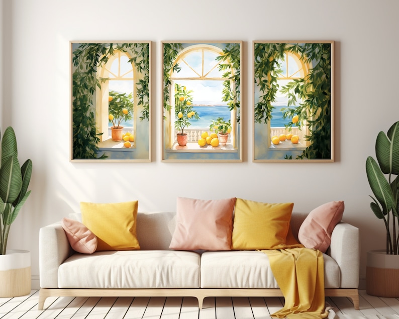 May include: Three framed watercolor paintings of windows with lemon trees and a view of the ocean. The windows are painted in a light yellow color with white trim. The lemon trees are green with yellow lemons. The ocean is blue and the sky is light blue.