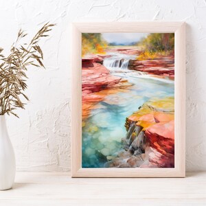 Puede incluir: Una pintura al agua enmarcada de una cascada que fluye a trav&eacute;s de un ca&ntilde;&oacute;n rocoso. El agua es de un azul turquesa vibrante y las rocas son una mezcla de rojo, naranja y amarillo. La pintura est&aacute; ambientada en un fondo de exuberantes &aacute;rboles verdes.
