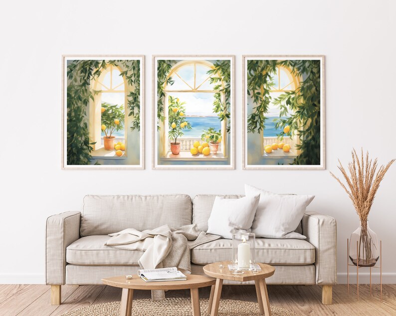 May include: Three framed watercolor paintings of windows with views of the ocean. Each window is adorned with a potted lemon tree and lemons on the windowsill. The windows are framed in wood with a white background.