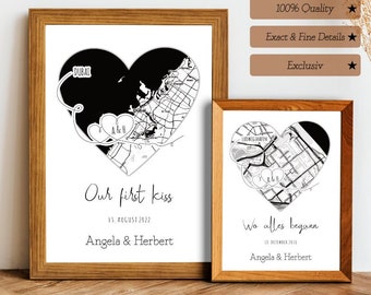 Può includere: Due stampe incorniciate in bianco e nero con mappe di Dubai e Londra a forma di cuore. Il testo sulle stampe recita "Our first kiss 11. AUGUST 2022 Angela & Herbert" e "Wo alles begann 11. AUGUST 2022 Angela & Herbert".