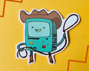 May include: A green and blue cartoon character wearing a brown cowboy hat and holding a lasso. The character is a video game console with a screen, buttons, and the text "BMO" on the side.