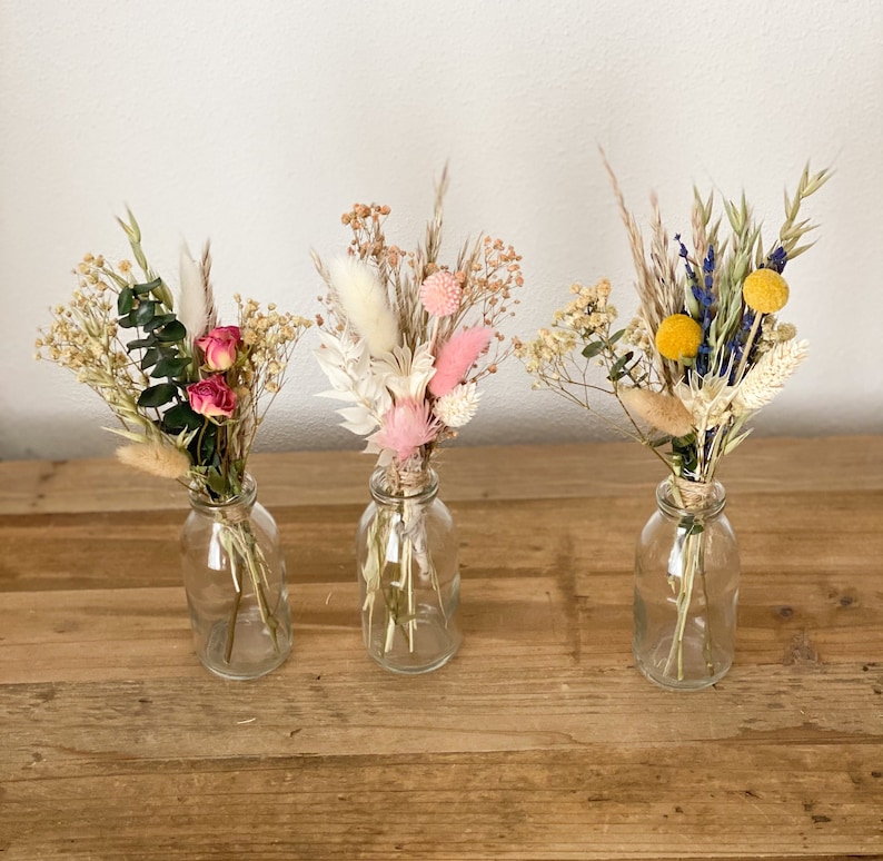 Small bouquet of dried flowers with vase in different colors with pampas grass, Craspedia, Lagurus, lavender, roses, phalaris, veil herb 