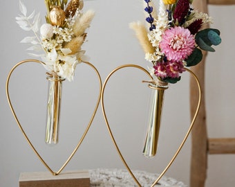 Dried flower bouquet with wooden vase in different colors with oats, craspedia, lagurus, glixia, phalaris