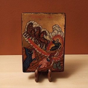 The Prophet Elijah (Ο Προφήτης Ηλίας) ascending into heaven, hand painted Greek Orthodox icon, with gold leaf canvas, on assymetric wood.