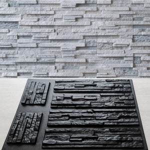 Op de afbeelding: Een zwarte en grijze textuurwandtegelvorm. De vorm is gemaakt van plastic en heeft een realistische steenstructuur. Het is ontworpen om een decoratieve wandtegel te maken.