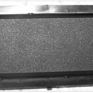 May include: A black rectangular vent cover with a textured surface.