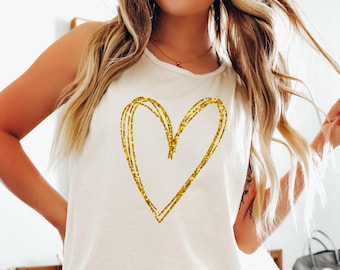 Comfort Colors® Canotta con cuore glitterato dorato, modello oversize senza maniche, ideale per tutti i giorni.