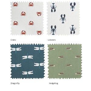 May include: Four fabric swatches with different patterns. The top left swatch features a white background with red crabs. The top right swatch features a white background with blue lobsters. The bottom left swatch features a teal blue background with white dragonflies. The bottom right swatch features a green background with brown hedgehogs.