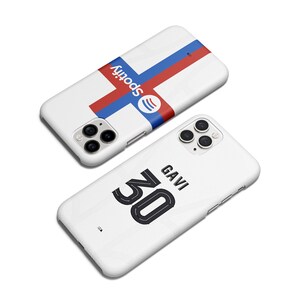May include: Two white phone cases. One case features a red, white, and blue design with the word "Spotify" and a Spotify logo. The other case has a black number "30" and the word "GAVI" printed on it.