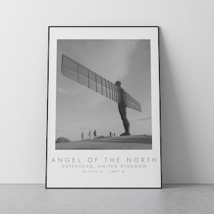 May include: Black and white photograph of the Angel of the North sculpture in Gateshead, United Kingdom. The sculpture is a large, winged figure with outstretched arms.