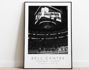 May include: Black and white photograph of the interior of the Bell Centre in Montreal, Quebec. The photo shows the arena during a hockey game, with the scoreboard hanging above the ice and the crowd cheering in the stands. The text "BELL CENTRE" is printed below the image, along with the city and coordinates: "MONTREAL, QUEBEC 45.4961° N, 73.5693° W"