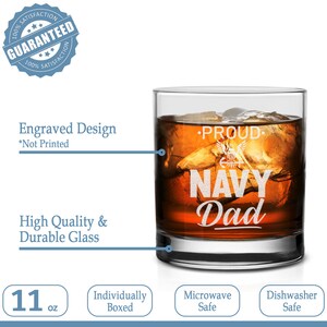 May include: An 11 ounce glass whisky tumbler with an engraved design that reads "Proud Navy Dad". The glass is microwave and dishwasher safe.