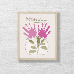 May include: A framed card with a handprint flower design in a jar. The card says "Happy Birthday Mimi!"