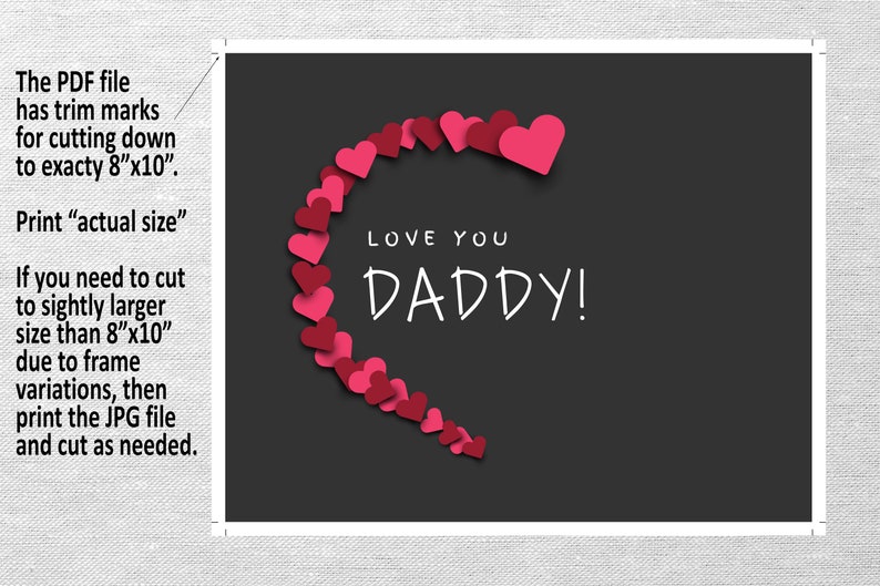 May include: A printable card with a black background and a heart shape made of pink hearts. The text "LOVE YOU DADDY!" is written in white inside the heart.