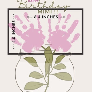 May include: A pink handprint art piece in a black frame with the text "Happy Birthday Mimi!!" and measurements "<-- 4.0 INCHES -->" and "<-- 6.4 INCHES -->". A green plant is in a clear glass jar.