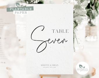 Roślinne numery stołów weselnych: papier z motywem stokrotek i maków