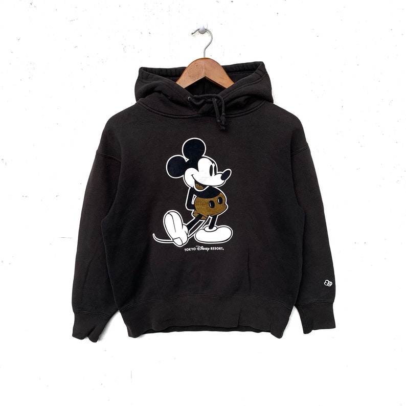 May include: Black hooded sweatshirt with a Mickey Mouse graphic and the text "Tokyo Disney Resort".