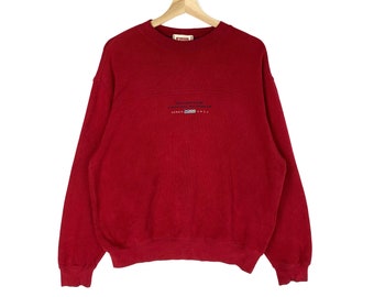 May include: Red sweatshirt with a white embroidered logo that says "Mount Everest" and "Premium International" with a small American flag.