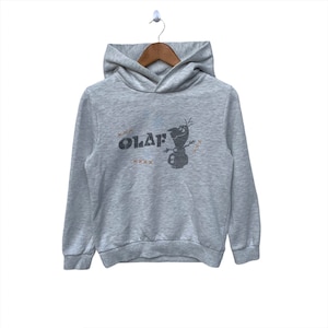 May include: A gray hooded sweatshirt with a black and white Olaf graphic and the word "OLAF" printed in brown.