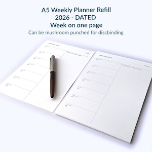 May include: A5 weekly planner refill for 2026, dated. The planner has a week-on-one-page layout and is designed for mushroom punching for discbinding. A pen rests on the open pages. The text "sje LONDON" is at the bottom.