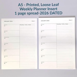 May include: A5 printed, loose-leaf weekly planner insert for 2026. The insert has a one-page spread with space for each day, including a section for priorities and notes. The text "JANUARY 2026" is visible.