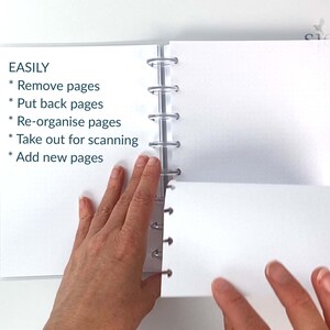 May include: A white notebook with a clear plastic binding. The notebook is open and the pages are blank. The text "EASILY" is written on the left page, followed by a list of bullet points: "Remove pages", "Put back pages", "Re-organise pages", "Take out for scanning", "Add new pages".