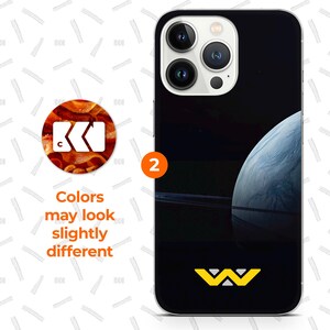 a black phone case with a space-themed design, including a planet and a star. The phone case has a black background and a white star on the bottom right corner. The text above the phone case states that colors may look slightly different, and the text below the phone case features a logo with the letters 'WV' on it.