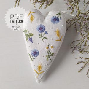 May include: A set of three ceramic mugs with a speckled, matte finish. The mugs are in shades of cream, light gray, and dark gray. Each mug has a simple, minimalist design, perfect for coffee or tea.