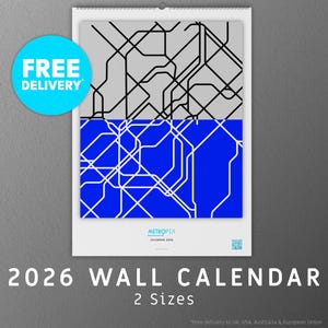 May include: 2026 wall calendar with a contemporary abstract design. The top half is grey with black lines, the bottom half is blue with white lines. Includes the words "FREE DELIVERY" in a blue circle.