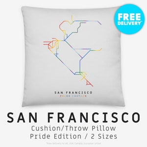 May include: White throw pillow with a rainbow-colored map of the San Francisco public transportation system. The text "SAN FRANCISCO PRIDE EDITION" is printed below the map.