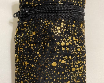 Wrist wallet in black w/gold paint splatter