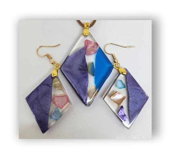 Handmade resin artistic necklace with matching earrings.