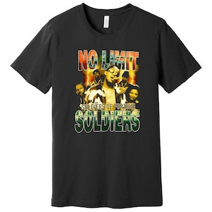 May include: Black t-shirt with a vintage-style graphic of a group of people with the text "NO LIMIT SOLDIERS OF FORTUNE SOLDIERS" in yellow, green, and red.