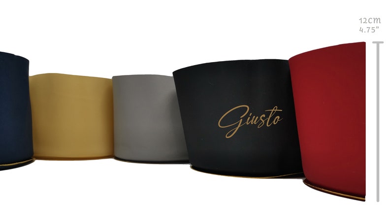 May include: A set of five cylindrical containers in navy, beige, gray, black, and red, each 4.75 inches tall. The black container features the word Giusto in gold script. Each container has a flat base and a smooth, solid-colored exterior finish.
