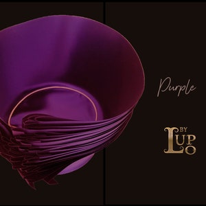 May include: A deep purple bowl with a smooth, curved interior and a layered, pleated exterior design. The text "Purple" is written in a script font above the gold-colored logo "L BY LUPO" on the right side of the dark background.