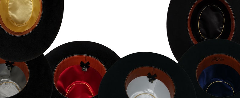 May include: A collection of black wide-brimmed hats shown from the interior. Each hat features a brown leather sweatband, a small black bow detail, and a satin lining in various colors including yellow, red, white, blue, black, and silver.