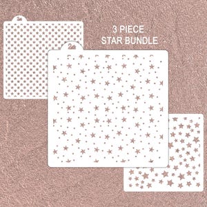 May include: Three white stencils with star patterns, including a dense field of stars, scattered stars, and a smaller design. The text "3 PIECE STAR BUNDLE" is above the stencils. The background is a textured, rose-gold color.