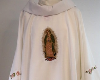 May include: White liturgical vestment with a floral design and an embroidered image of the Virgin of Guadalupe.